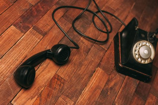 retro telephone technology antique communication nostalgia wood floor. High quality photo