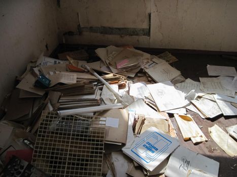 Old paper archives of an abandoned power plant. old unnecessary paper.