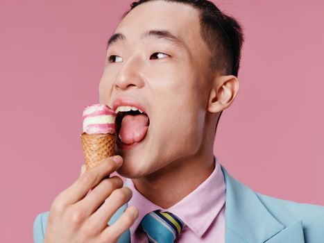 A man in a suit examines ice cream in a cone and professional . High quality photo