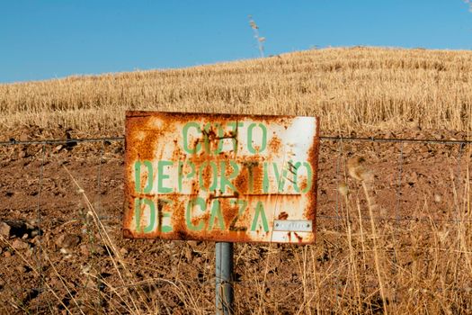 Hunting ground sign at sunset in southern Andalusia, Spain