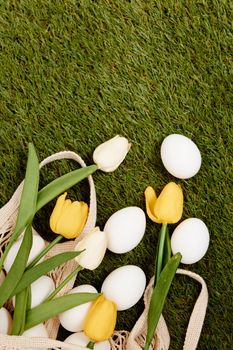 Yellow tulips white eggs spring holiday easter tradition. High quality photo