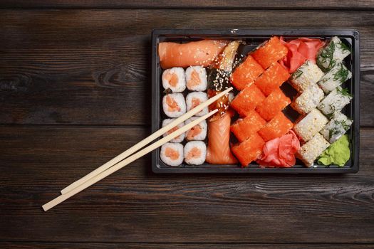 asian food sushi rolls tradition wooden table chopsticks. High quality photo