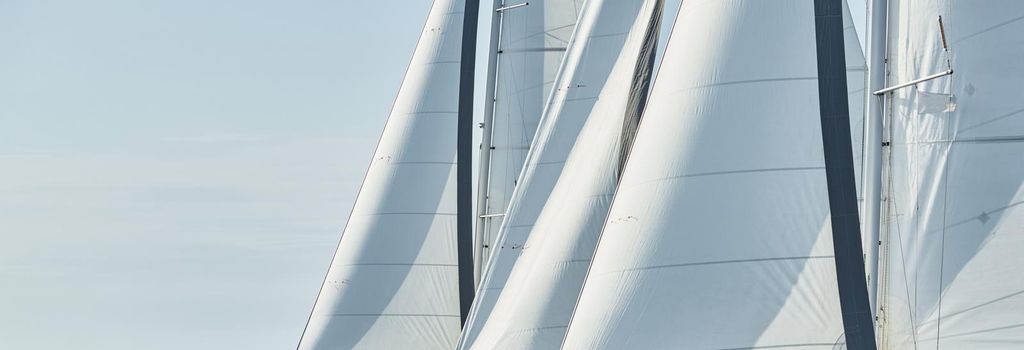 Spinnaker and sail of white color, Sailboats compete in a sailing regatta at sunset, sailing race