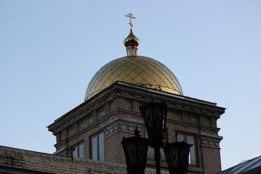 Orthodoxy. The golden domes of the Christian temple against the blue sky.