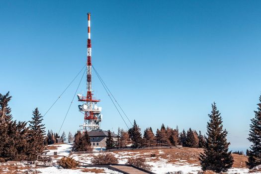 transmitter with satellites and antennas on top of the hill.