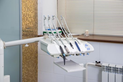 White dental equipment tools for the treatment and filling of teeth in the doctor's office.