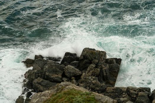 Seascape with waves crashing on rocks