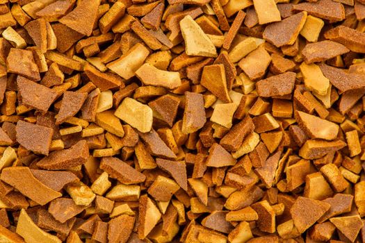 freeze-dried instant coffe granules high magnification macro photo.