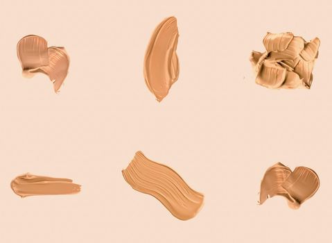 Liquid foundation smudges, smears and strokes as makeup textures isolated on beige background, beauty and cosmetics set