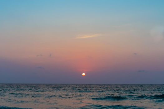 Colorful vibrant ocean sea wave beach summer with sunrise or sunset background landscape on vacation day. 