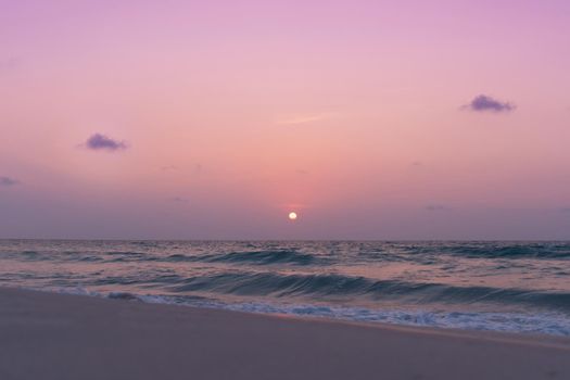 Colorful vibrant ocean sea wave beach summer with sunrise or sunset background landscape on vacation day. 