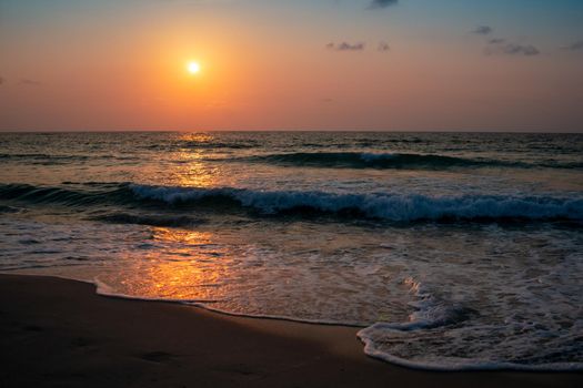 Colorful vibrant ocean sea wave beach summer with sunrise or sunset background landscape on vacation day. 