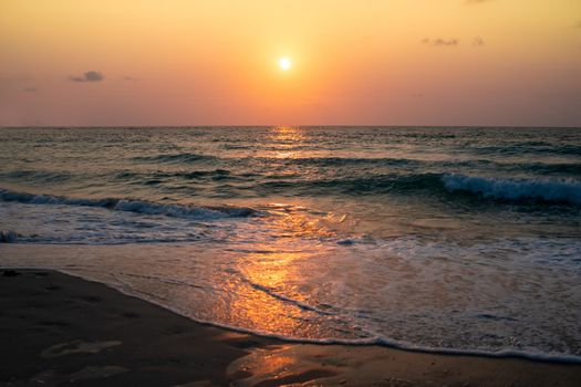 Colorful vibrant ocean sea wave beach summer with sunrise or sunset background landscape on vacation day. 