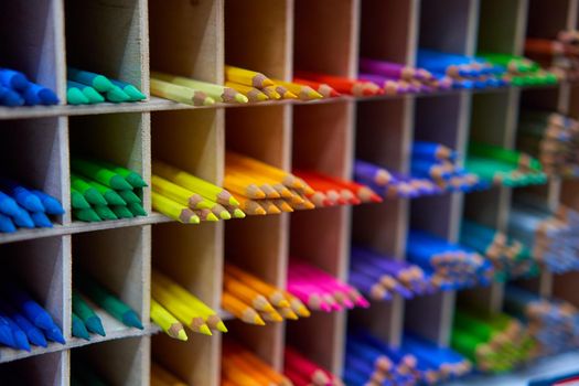 Showcase with colored pencils for drawing in the store for artists or stationery Art concept background