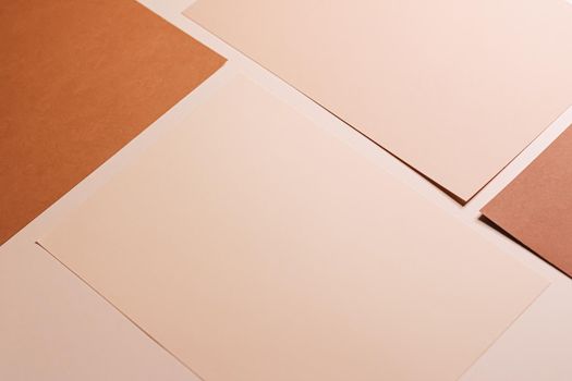 Beige and brown A4 papers as office stationery flatlay, luxury branding flat lay and brand identity design for mockups