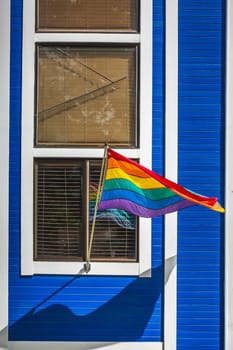 Rainbow pride flag in the window at Castro neighborhood in San Francisco, California, USA.