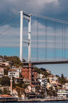 Fatih Sultan Mehmet bridge view from Bosphorus strait in Istanbul Turkey from ferry on a sunny summer day.