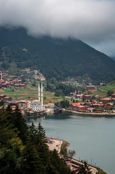 View of the mosque on the shore of the mountain lake Uzungol, Trabzon, Turkey.