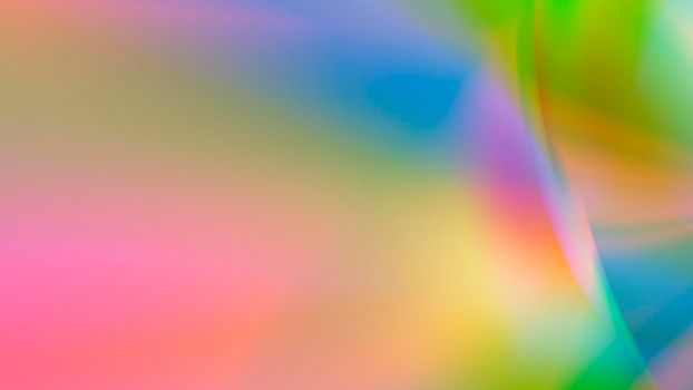 Abstract blurred rainbow background with texture.