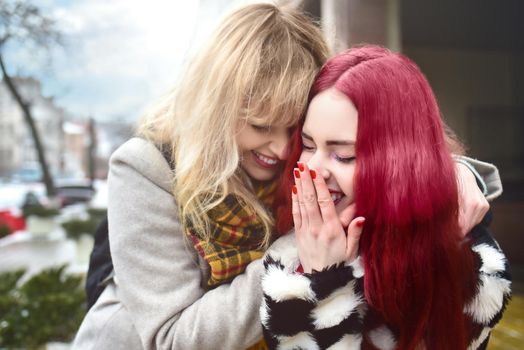 Beautiful Lgbt Couple. Hug of two lesbian Women. Blonde and red Hair Models.
