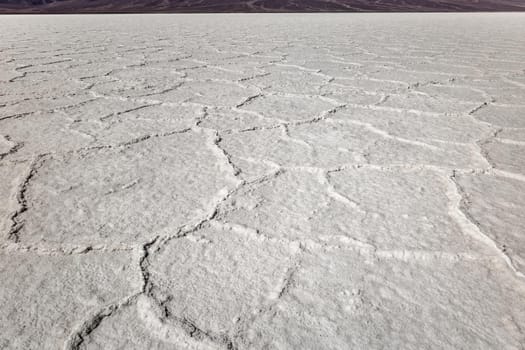 Death Valley salt flats near the badwater area of the national park. The crusted salt rises to the desert surface and bakes in the sun.