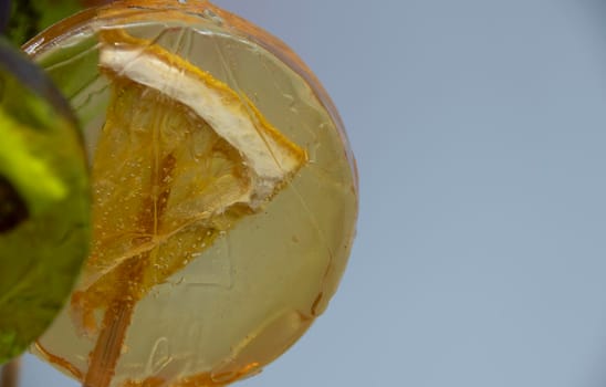 Fruit lollipops with different berries and fruits inside close-up.