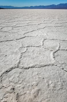 Death Valley salt flats near the badwater area of the national park. The crusted salt rises to the desert surface and bakes in the sun.