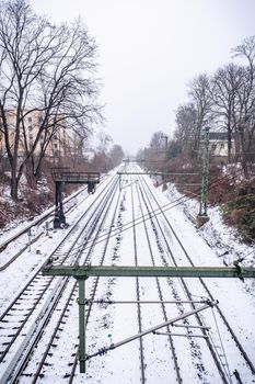 View of the rails in the snow from the bridge in Hamburg in winter.