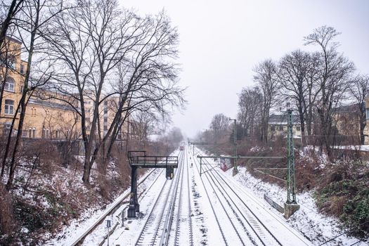 View of the rails in the snow from the bridge in Hamburg in winter.