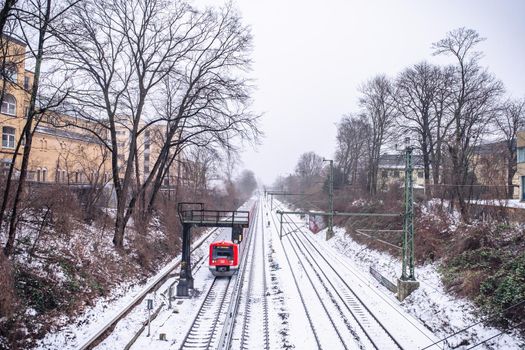 View of the rails in the snow from the bridge in Hamburg in winter.