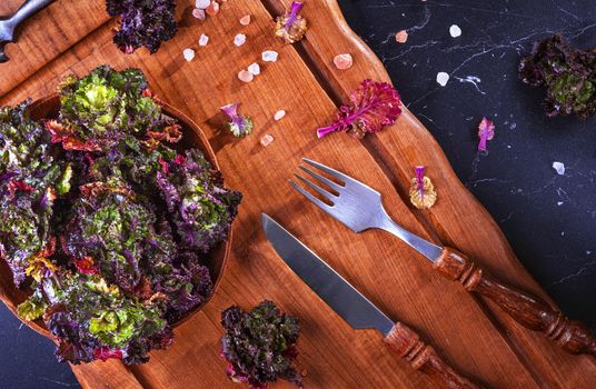 Fresh, healthy, colourfull Kalettes flower sprout on a wooden background.