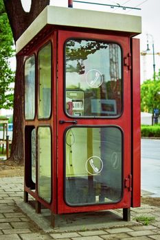 Old telephone booth in Budapest, Hungary. An old public phone in Budapest. Types of communication of the past.