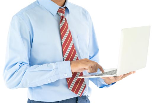 Businessman holding a laptop over white background with clipping path