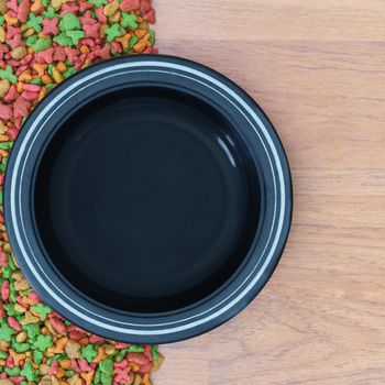 Top view dry food for cat and dog with empty bowl