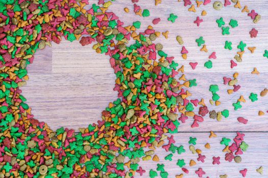 Top view dry cat food on wooden background with copy space