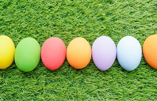 Close up Colorful easter eggs on on green gras background