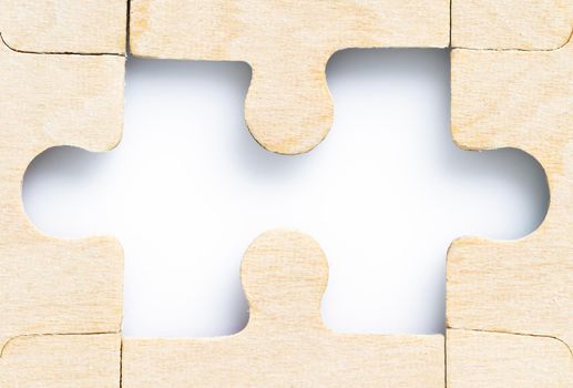 Close up shot of Missing jigsaw puzzle pieces on white background,business concept