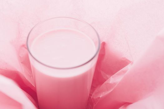 Strawberry milk inside pink paper packaging as sweet drink, food service flat lay and meal delivery concept