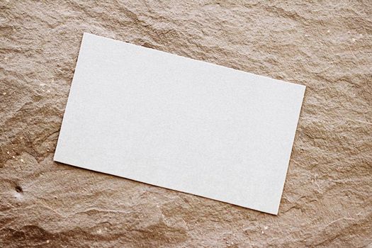 White business card flatlay on brown stone background, luxury branding flat lay and brand identity design for mockups