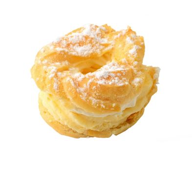 Sweet baked pastry in the shape of wreath with vanilla whipped cream and sprinkled with sugar, isolated over white background. Traditional Czech sweet pastry called venecek.