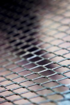 Grating with defocused rhombus shaped background. No people
