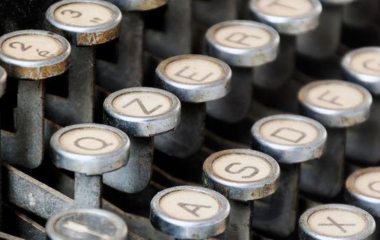 Keys of an old typewriter. Round and dusty keys. Work tool for writers and journalists. Vintage object. Mechanical Technology