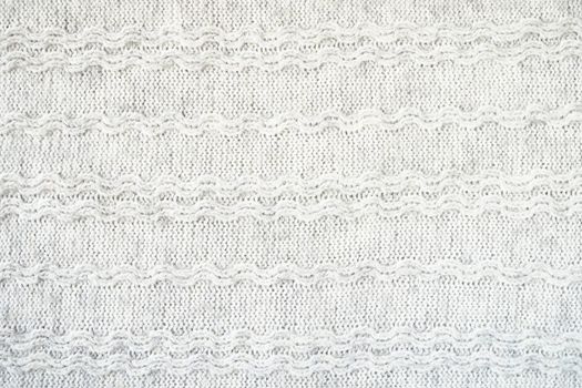 The texture of the woollen product. Grey background. High quality photo