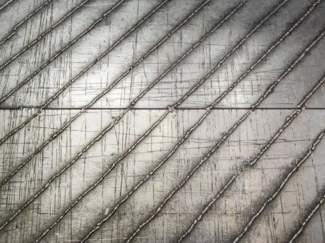 flat steel floor with hand welded diagolnal skid-proof lines.