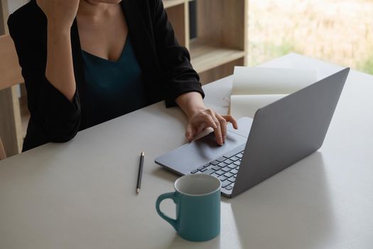 woman looking at laptop screen, reading listening online courses, studying remotely from home due to pandemic corona virus world outbreak, quarantine time.