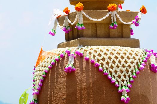 sand pagoda in Songkran festival represents In order to take the sand scraps attached to the feet from the temple to return the temple in the shape of a sand pagoda