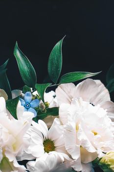 Flower bouquet on black background, beautiful floral arrangement, creative flowers and floristic design ideas