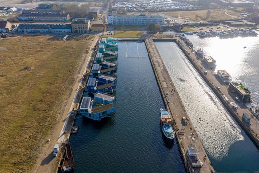Copenhagen, Denmark - February 25, 2021: Drone view of Urban Rigger, a housing unit floating on water by architect Bjarke Ingels Group