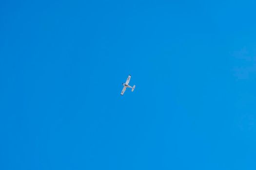 a pleasure plane in a clear blue sky. High quality photo