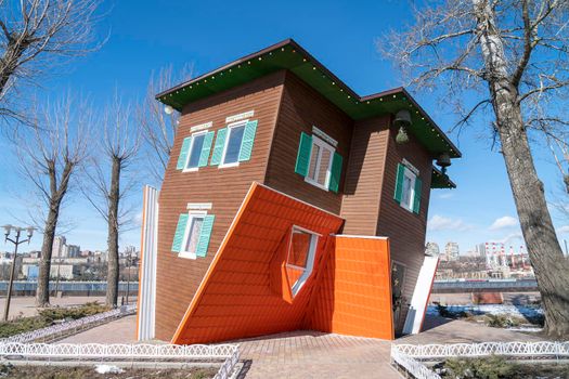 house upside down on the background of the city. High quality photo